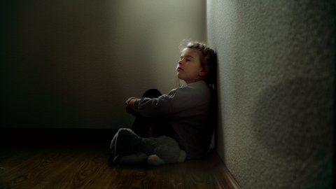 Little girl in the dark claustrophobic environment.  Abandoned child. Difficult childhood. 库存视频
