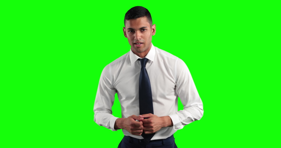 Attractive mixed race businessman with short dark hair, wearing a white shirt and dark tie, talking and gesturing, looking at camera on green screen background Royalty-Free Stock Footage #1053345281