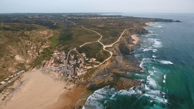 Aerial video shooting. Monte Clerigo surf beach on the Atlantic coast. Portugal, Aljezur, Sagres, Algarve, next to the Costa Vicentina.
