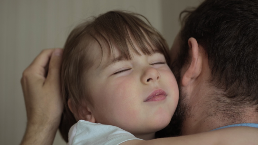 Happy Foster Family. Adorable Small Child Son Embrace Adoptive Daddy Cuddling Enjoy Tender Sweet Moment. Affectionate Little Kid Boy Hugging Father With Eyes Closed. Child Boy Hugging Foster Father. Royalty-Free Stock Footage #1053364538