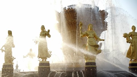 Moscow/Russia - JUNE 01.2019: Unique sculptural ensemble. Fountain Friendship of Peoples at the All-Russian Exhibition Vdnkh. Golden female figures are symbols of all Soviet republics.