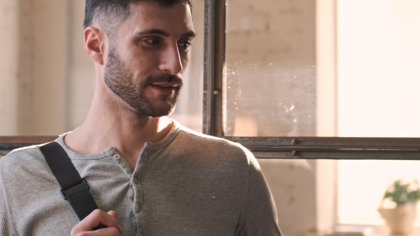 Happy positive young business colleagues indoors in office talking with each other