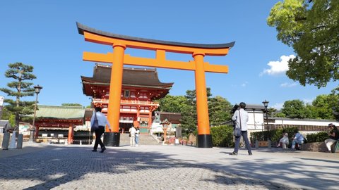 People walk around the entrance to Fushimi Inari Shrine during a state of emergency declared in Kyoto, Japan, May 28, 2020.