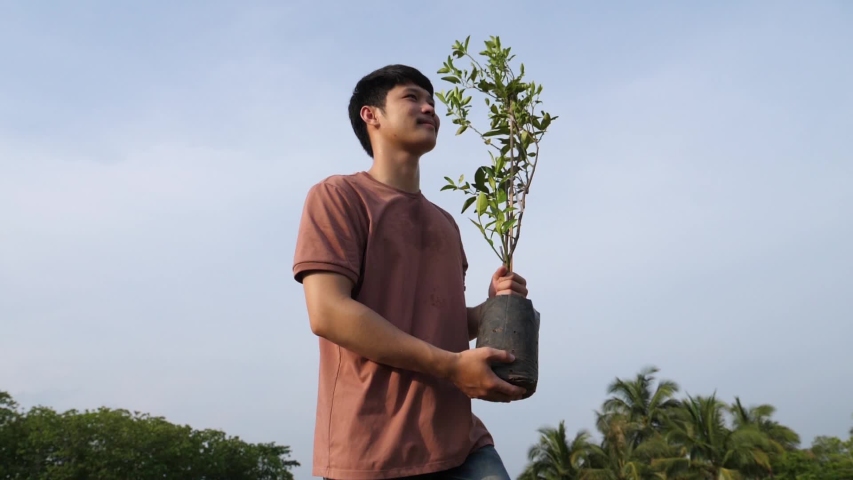 Man Going To Plant A Tree
