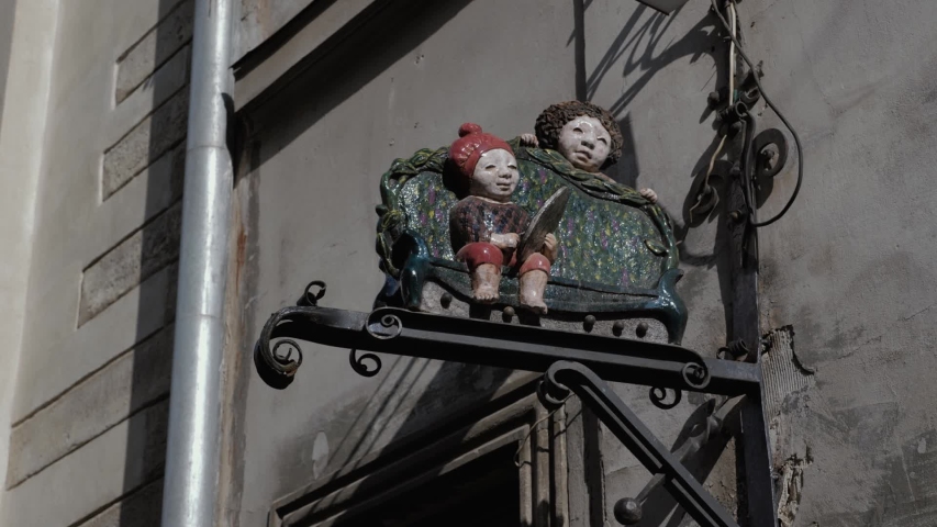 Figures of dolls. doll sculpture. Ancient Europe. Beautiful ancient city. European houses and cafes. Narrow cobbled streets. city without people. summer terraces in europe. Lviv