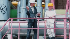 Talking workers at factory. Employee receives instructions from manager. Digital signature on tablet device and add it to documents needing an electronic signature. Artificial intelligence integration - Powered by Shutterstock - Get 15% off with code: PIKWIZARD15