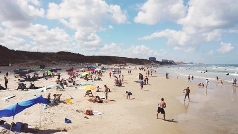 ISRAEL - Herzliya, 29 May 2020: many people came to rest on the Mediterranean beach after quarantine was lifted due to the corovirus