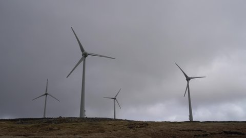 Wind Turbine Farm on the hill near Torshavn in cloudy day, Streymoy Island, The Faroe Islands.