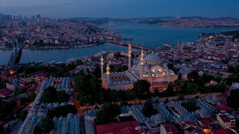 Mystique Suleymaniye Mosque at sunset sky, the aerial view of the city of Istanbul, the Golden Horn, Turkey.