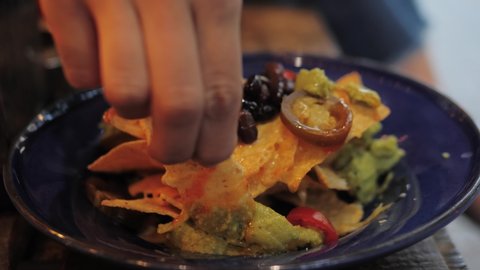close-up of plate full of nachos, mexican food