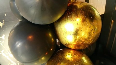 gold and black balloons for decoration of the ceiling of the restaurant for a wedding or party in Golden style