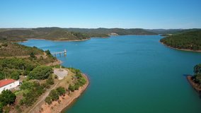 Aerial video shooting. Reservoir, dam bravura, drinking water supplies from a bird's eye view. Portugal, Algarve, Monchique. Europe.