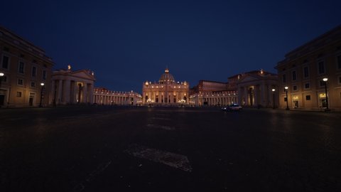 Dolly shot over the empty Piazza San Pietro towards the Saint Peter's Basilica, night, in Vatican, Rome, Italy - Coronavirus Pandemic