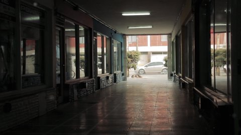 Empty Hallway and Closed Stores during the Coronavirus Quarantine in Buenos Aires, Argentina. Zoom Out.