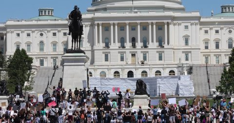 Washington, DC / USA - May 30, 2020: Crowds gather at the US Capitol building to protest the death of George Floyd.
