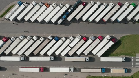 trucks in the parking lot, shot from the drone in 4k