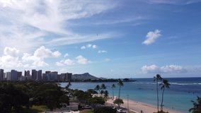 Cinematic aerial drone video of Ala Moana Beach, amidst the backdrop of iconic Diamond Head in Hawaii.