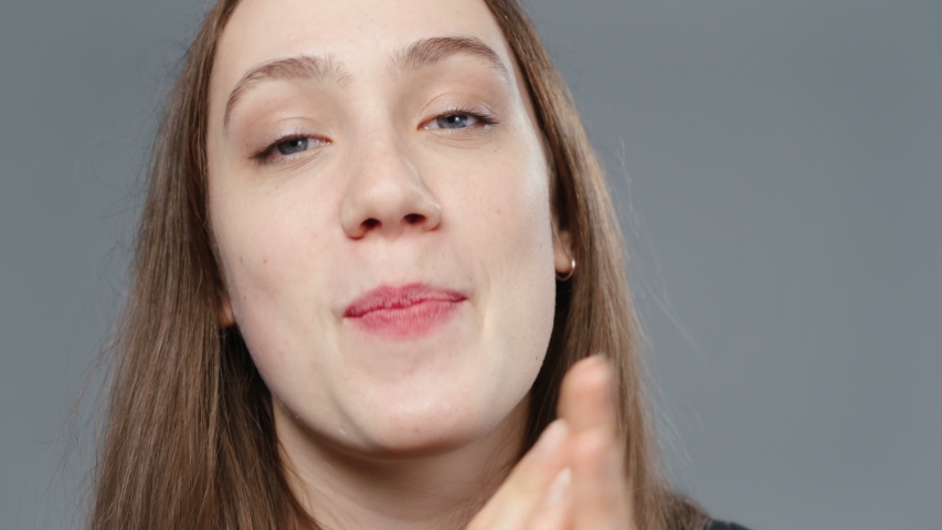 Video of young applauding girl in black shirt, portrait