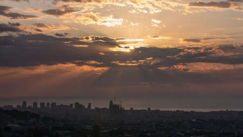 Sunrise over Barcelona city skyline. Time lapse of the daybreak. Spain, 2020.