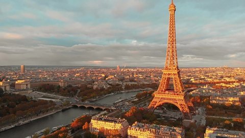 Aerial drone view of Paris Eiffel Tower Tour de Eiffel and panoramic view over Seine River and Paris city attractions at sunset 