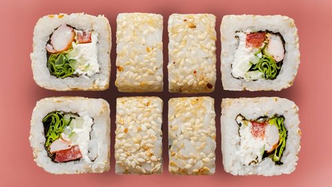 Stop motion video sushi rolls on colorful backgrounds. The menu of the online restaurant is a diverse sushi shot from above.