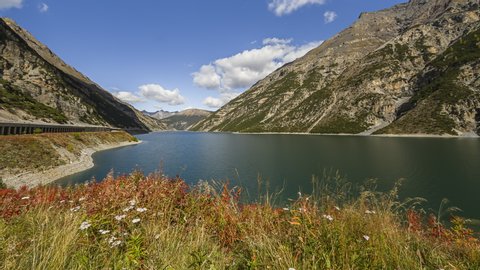 Livigno, Italy - October 2, 2014: Lake of Livigno is a reservoir in the Livigno valley. The reservoir is mostly in Italy whereas the Punt dal Gall arch dam is crossed by the border with Switzerland.