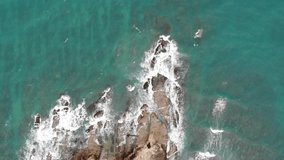 An aerial footage of beautiful bluish sea and waves at the tips of Borneo, Kudat Sabah, Malaysia. Sabah's northernmost headland, at the end of a wide bay 40km from Kudat.
