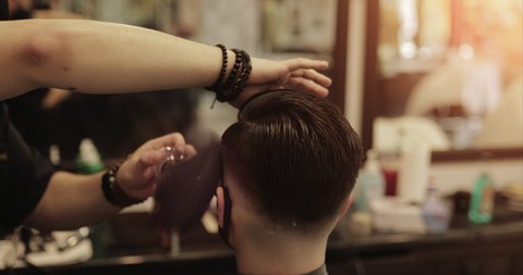 Barbershop in new conditions. Haircut in a beauty salon. Haircut clipper and scissors. Video 4k