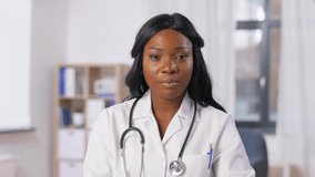 medicine, online service and healthcare concept - african american female doctor having online consultation at hospital