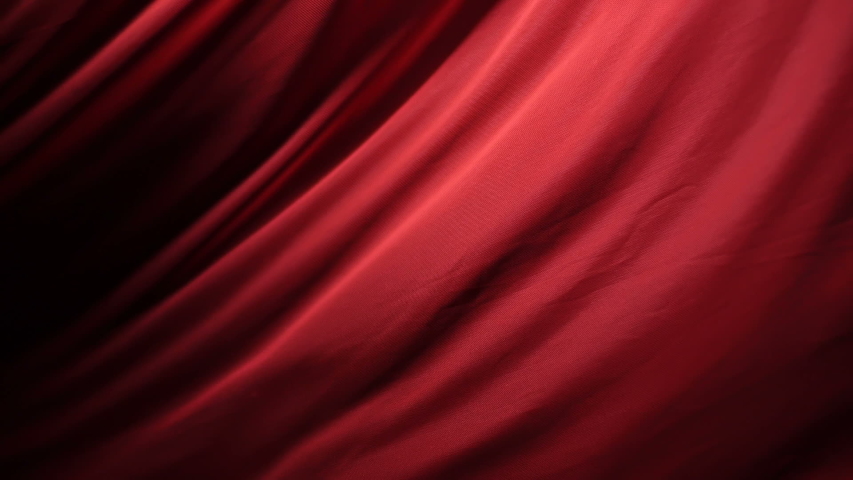 The chic and elegant texture of the moving folds of light red fabric on a black background under dramatic lighting. Slow Motion 200 FPS Royalty-Free Stock Footage #1053522626