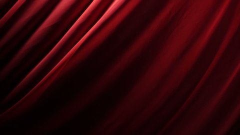 The chic and elegant texture of the moving folds of light red fabric on a black background under dramatic lighting. Slow Motion 200 FPS