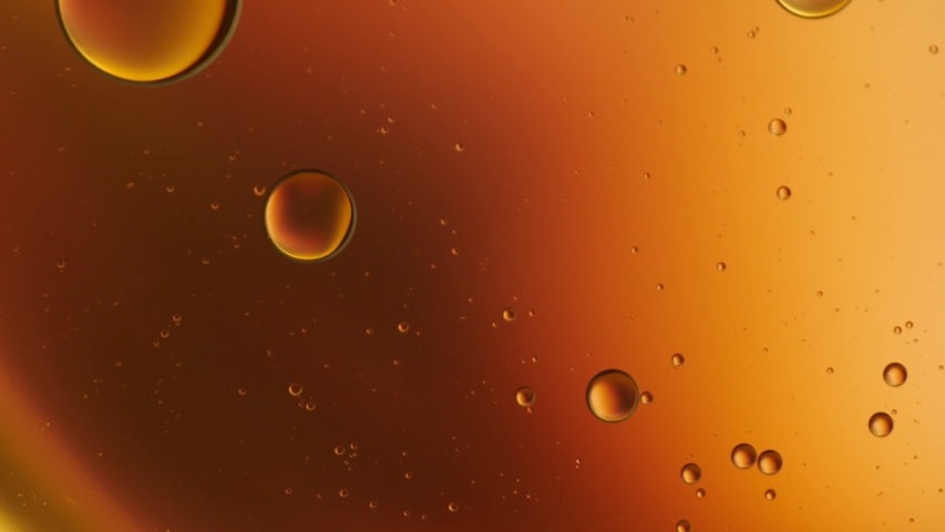Oil drop floating on the water. Abstract bubble background. | Shutterstock HD Video #1053524813