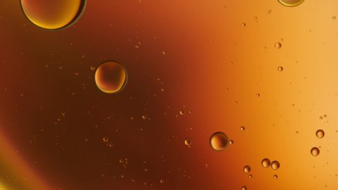 Oil drop floating on the water. Abstract bubble background.