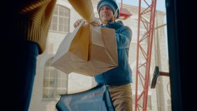 Female Customer Opens Door to a Happy Food Delivery Man Wearing Thermal Backpack on a Bike and Recieves Restaurant Order. Courier Delivers Takeaway Lunch to Gorgeous Girl. Inside Shot - Powered by Shutterstock - Get 15% off with code: PIKWIZARD15