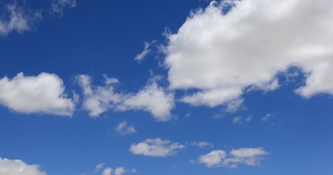 Cumulus clouds form against brilliant Blue skies sky