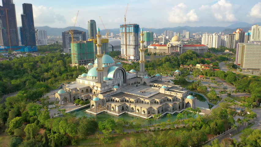 aerial view 4k video of the Federal Territory Mosque, or Masjid Wilayah Persekutuan, Kuala Lumpur, Malaysia on sunset. Royalty-Free Stock Footage #1053529601