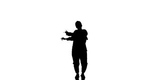 Attractive female modern style dancer performing in the studio. Hip hop street dance on a stage in front of the spotlight. Silhouette. Contemporary choreography - Powered by Shutterstock - Get 15% off with code: PIKWIZARD15