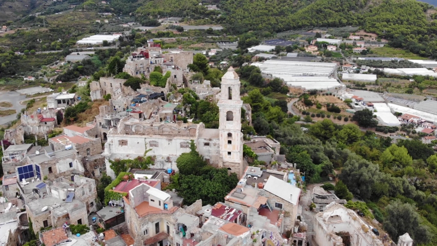 Aerial view of ancient italian village Bussana Vecchia. View from above of old houses and church. Ghost city in 4K | Shutterstock HD Video #1053534407