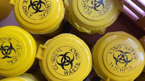 4K footage of yellow clinical waste bin used during Covid19 pandemic
