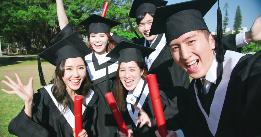 Slow motion of group happy graduates students use mobile phone to take selfie together | Shutterstock HD Video #1053543563