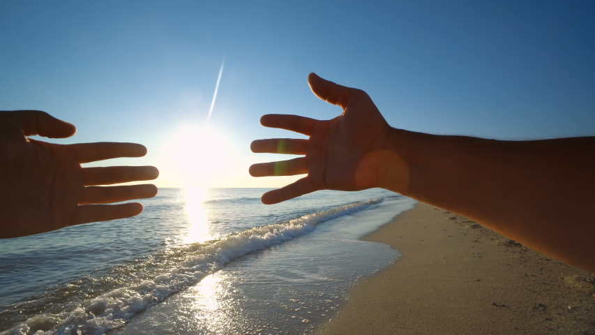 Two hands holding puzzle at beach sunset Royalty-Free Stock Footage #1053548672