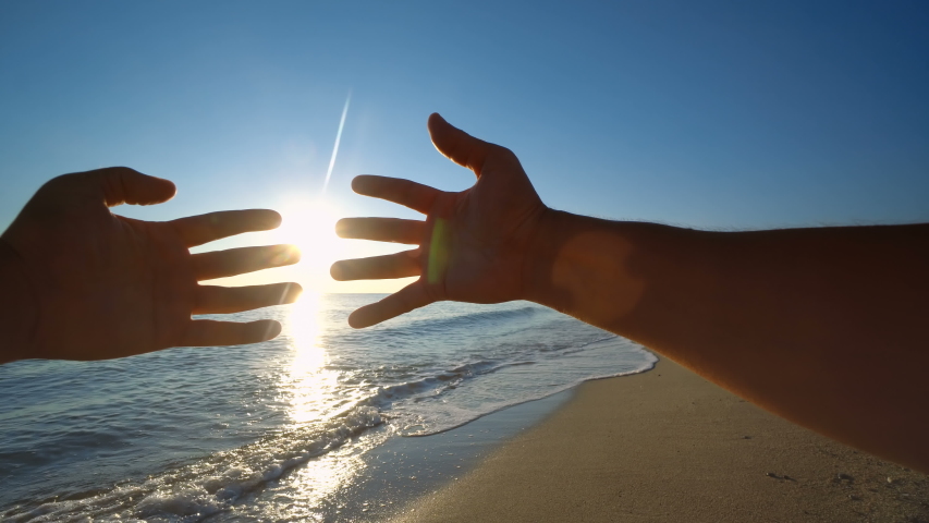 Two hands holding puzzle at beach sunset | Shutterstock HD Video #1053548672
