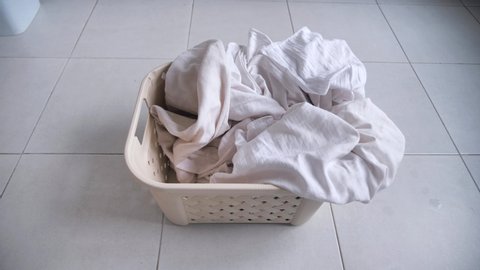 throw white bedding in a drawer. concept of housework.