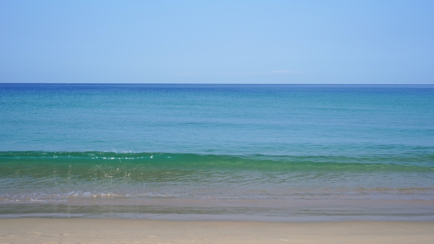 eautiful seascape with white sand and wave at tropical beach