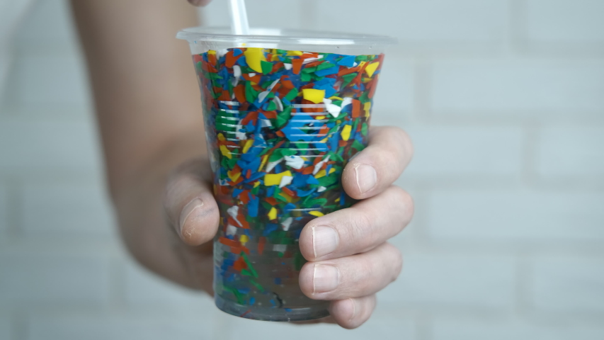 Microplastic. Plastic cup with microplastic. | Shutterstock HD Video #1053564983
