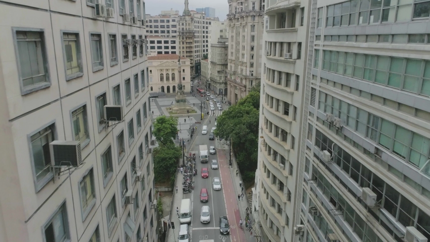 Aerial View through buildings of the city downtown in sao paulo brazil. Busy street fincancial center
