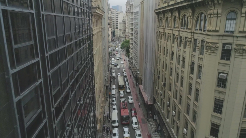 Aerial View through buildings of the city downtown in sao paulo brazil. Busy street fincancial center
