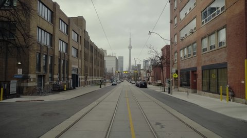 Empty street in downtown Toronto during the Covid19 Coronavirus Quarantine. CN Tower in the distance, looks like a ghost Town.