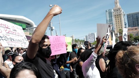 Miami Downtown, FL, USA - MAY 31, 2020: Black Lives Matter. Many american people went to peaceful protests in the US against the George Floyd death: people are protesting. White and black together