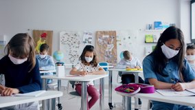 Group of children with face mask back at school after covid-19 quarantine and lockdown. - Powered by Shutterstock - Get 15% off with code: PIKWIZARD15